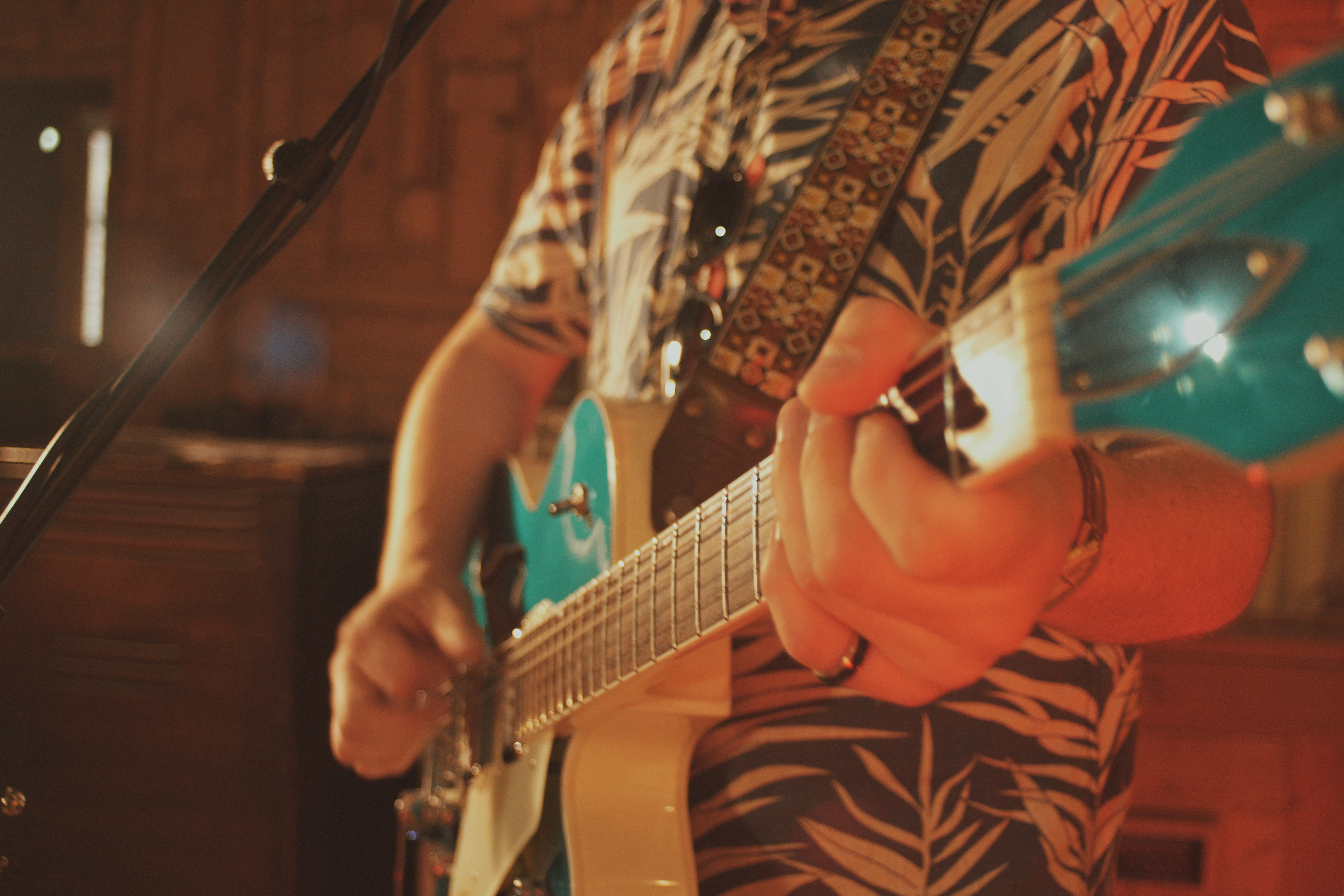 A close-up of a guitarist performing live